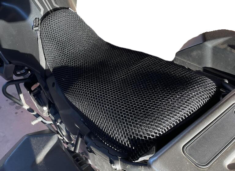 Cool Dry Covers motorbike seat covers feature a unique 3-dimensional mesh which keeps you raised off the seat for added comfort, staying much cooler in the heat and allowing beneficial air circulation. Water flows through without absorbing so you stay drier on the wet days. Sized specifically for your motorbike seat.  Shown here installed on a Kawasaki KLR650.