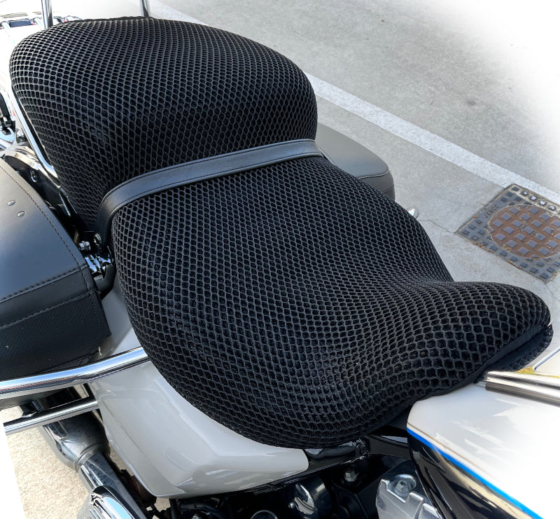 Cool Dry Covers seat covers to fit your Harley Davidson Road King Tall Boy (pictured).  Keeps you raised off the original seat, much cooler in the heat and allows air circulation.  Water goes through without being absorbed so you stay drier in the wet.  These are sized to fit your specific seat perfectly.  Transform your ride with Cool Dry Covers.