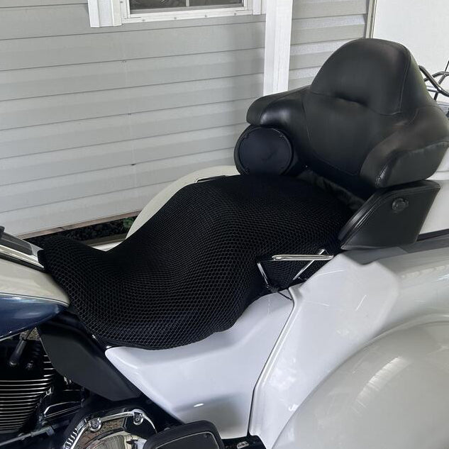 Cool Dry Covers seat covers to fit your Harley Tri Glide Ultra (pictured, optional backrest available for King Tour-Pak Passenger Backrest).  Keeps you raised off the original seat, much cooler in the heat and allows air circulation.  Water goes through without being absorbed so you stay drier in the wet.  These are sized to fit your specific seat perfectly.  Transform your ride with Cool Dry Covers.