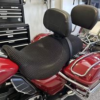 Cool Dry Covers seat covers to fit your Harley Tri Glide with backrest (pictured, backrest cover optional).  Keeps you raised off the original seat, much cooler in the heat and allows air circulation.  Water goes through without being absorbed so you stay drier in the wet.  These are sized to fit your specific seat perfectly.  Transform your ride with Cool Dry Covers.