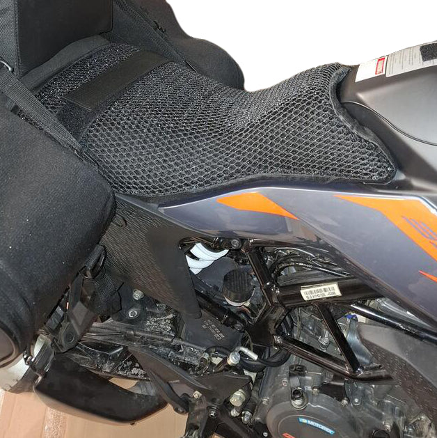 Cool Dry Covers seat covers to fit your KTM 390 Adventure (pictured).  Keeps you raised off the original seat, much cooler in the heat and allows air circulation.  Water goes through without being absorbed so you stay drier in the wet.  These are sized to fit your specific seat perfectly.  Transform your ride with Cool Dry Covers.