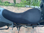 Cool Dry Covers seat covers to fit your Suzuki DR650 Custom (pictured).  Keeps you raised off the original seat, much cooler in the heat and allows air circulation.  Water goes through without being absorbed so you stay drier in the wet.  These are sized to fit your specific seat perfectly.  Transform your ride with Cool Dry Covers.