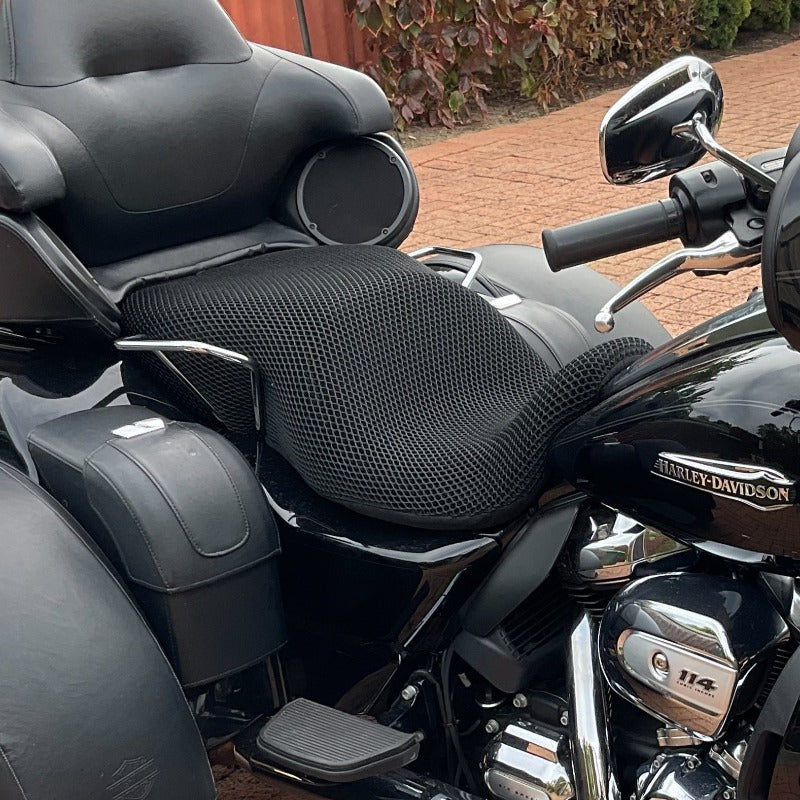 Cool Dry Covers seat covers to fit your Harley Davidson Tri Glide (pictured).  Keeps you raised off the original seat, much cooler in the heat and allows air circulation.  Water goes through without being absorbed so you stay drier in the wet.  These are sized to fit your specific seat perfectly.  Transform your ride with Cool Dry Covers.