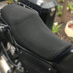 Cool Dry Covers seat covers to fit your Royal Enfield Himalayan (pictured).  Keeps you raised off the original seat, much cooler in the heat and allows air circulation.  Water goes through without being absorbed so you stay drier in the wet.  These are sized to fit your specific seat perfectly.  Transform your ride with Cool Dry Covers.